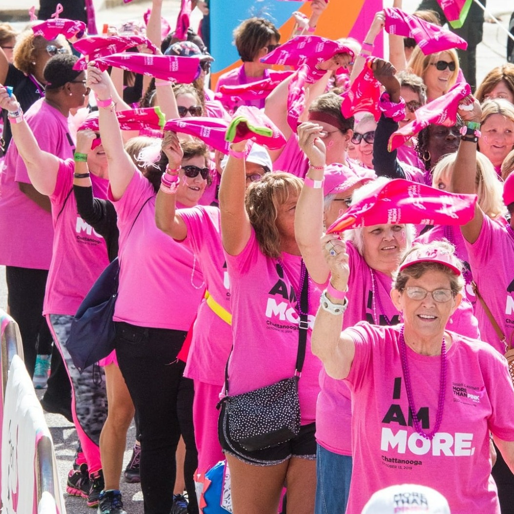 Photo of a group of women dressed in pink tshirts for the More Than Pink Walk, with Susan G Komen.
